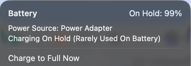 Image showing "Charging on hold" message in MacBook.