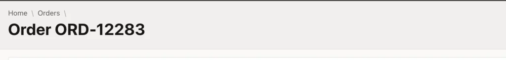A breadcrumb showing a record name on an Oracle APEX form