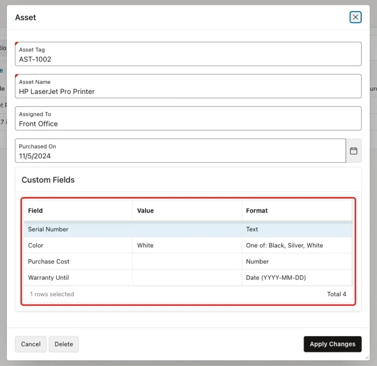Asset dialog for AST-1002 with the Custom Fields grid marked with a red box: Serial Number, Color White, Purchase Cost and Warranty Until